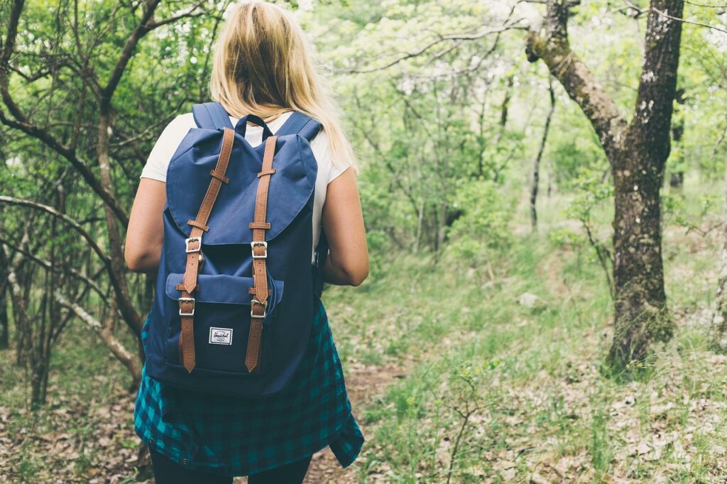 Greenhouse wellbeing activities with woman hiking